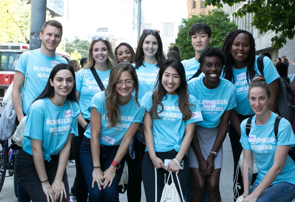 Group of nursing student in blue shirtss outside